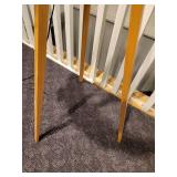 A Tripod Floor Lamp with wood legs.