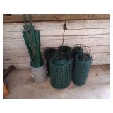 Group of Garden Fence Rolls and Metal Fence Posts