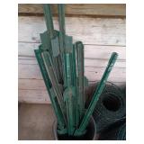 Group of Garden Fence Rolls and Metal Fence Posts