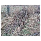 Collection of Used Metal Fence Posts and Supports