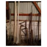 Assorted Metal and Plastic Pipes with Rebar and Fence Posts Collection