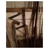 Assorted Metal and Plastic Pipes with Rebar and Fence Posts Collection