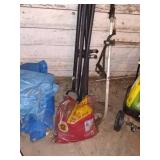 Group of Lawn Care Tools with Spreaders, Trimmers, Tarps, and Supplies