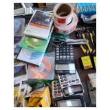 Lot of Office Supplies and Media Including Calculators, Label Rolls, CDs, and More
