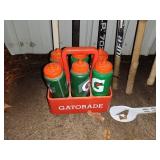 Sports Equipment Lot: Hockey Sticks, Golf Bags with Clubs, and Water Bottle Carrier