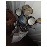 Sports Equipment Lot: Hockey Sticks, Golf Bags with Clubs, and Water Bottle Carrier