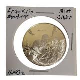 Franklin Mint Tribute Coin: World War II Veterans 11.50 grams of sterling silver proof coin.