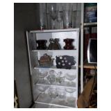Wooden shelf with assorted glassware