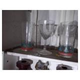 Wooden shelf with assorted glassware