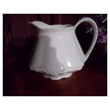 Water pitcher, Roseville candle, flower pot