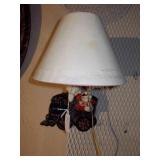 This is a vintage ceramic train table lamp.
