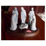 The image shows a set of porcelain figurines from the "The Christmas Story" nativity set