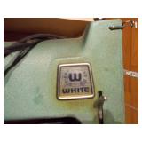 vintage sewing machine, identified as a potentially a White Sewing Machine from the mid-century era.