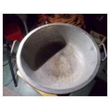 Huge metal pot, like a wok.