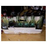 vintage collectible pack of Coca-Cola glass bottles in their original cardboard carrier.