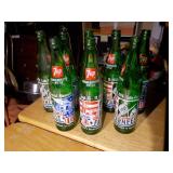 vintage 7 Up soda bottles, specifically commemorative editions related to the United States Bicentennial in 1976.