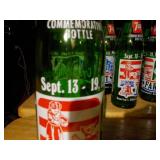 vintage 7 Up soda bottles, specifically commemorative editions related to the United States Bicentennial in 1976.