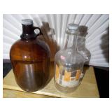 2 Brown A & W bottles, A&W Root Beer "Bulls Eye" logo on the lid.