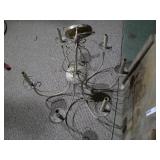 This is a six-arm wrought iron candle chandelier