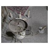 This is a six-arm wrought iron candle chandelier