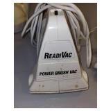 Household Utility Lot: Wall Clock, Watering Can, ReadiVac Power Brush Vac, Garden Kneeler, and Work Glove