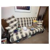 Black Metal Futon with Plaid Cushions and Pillows