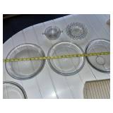 Assorted Kitchenware Lot Including Pyrex Pie Plates, Vintage South Dakota Tin, and Serving Dishes