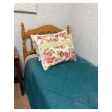 Twin Size Wooden Bed Frame with Teal Comforter and Floral Pillow Shams