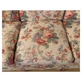 Floral Upholstered Sofa with Rolled Arms and Skirted Base