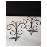 2 candles and 2 candle holders