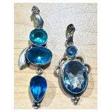 Pair of Blue Gemstone Silver Pendants with Unique Designs