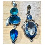 Pair of Blue Gemstone Silver Pendants with Unique Designs