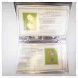 Decorative Collectors Folder with 6 Uncirculated Sacagawea dollar coins and vintage stamps