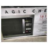 Magic Chef 1.6 cu. ft. 1100W countertop microwave in stainless steel.
