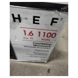 Magic Chef 1.6 cu. ft. 1100W countertop microwave in stainless steel.