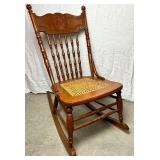 Cane Seat Antique Rocking Chair with North Wind Motif