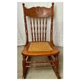 Cane Seat Antique Rocking Chair with North Wind Motif