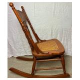 Cane Seat Antique Rocking Chair with North Wind Motif