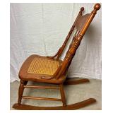 Cane Seat Antique Rocking Chair with North Wind Motif