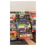 Large Collection of Vintage VHS Tapes Including Hitchcock, Dean Martin, Jaws, and More