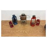 Collection of 5 Vintage Metal Lanterns Including Kamp Lite and Assorted Red and Blue Lanterns