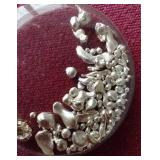 Small Capsule of Silver Grains