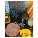 LR - Mixed Kitchenware Lot with Cutting Boards, Trivets, Pitcher, and Accessories