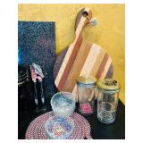 LR - Mixed Kitchenware Lot with Cutting Boards, Trivets, Pitcher, and Accessories