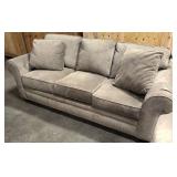 Upholsters Sleeper Couch with tags still on it