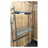 Over the toilet metal shelf and toilet paper holder