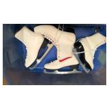 Tote with two pairs of hockey skates, 2 pairs of figure skates, and hockey helmet