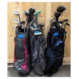 three right handed sets of golf clubs