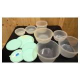 7 Tupperware containers with 5 lids