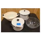 Two pots with lids, strainer, and large plastic bowl